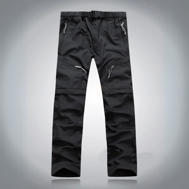 Laden Sie das Bild in Galerie -Viewer, Schwarze Outdoor-Hose mit mehreren Reißverschlusstaschen, strapazierfähigem Material und verstellbarem Bund, ideal für Wandern und Trekking.
