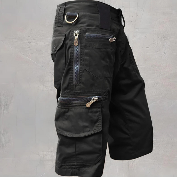 Schwarze taktische Cargo-Shorts mit mehreren Reißverschlusstaschen und D-Ring, ideal für Outdoor-Aktivitäten und Abenteuer.