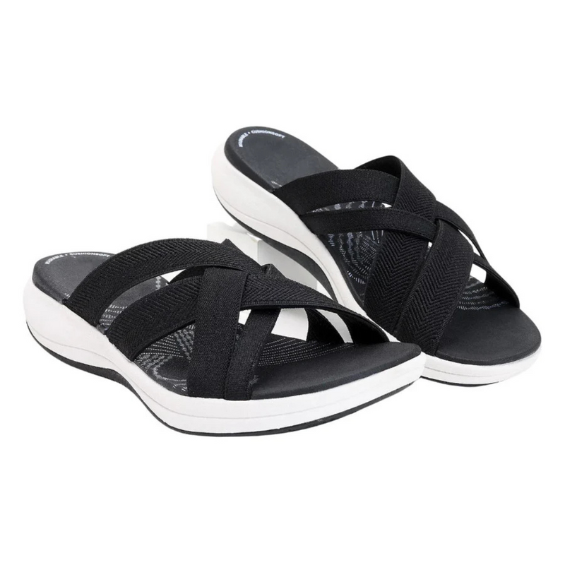 Laden Sie das Bild in Galerie -Viewer, Schwarze Damen-Sandalen mit überkreuzten Riemen und weißer Sohle, bequemes Design, ideal für Sommermode und Freizeitkleidung.
