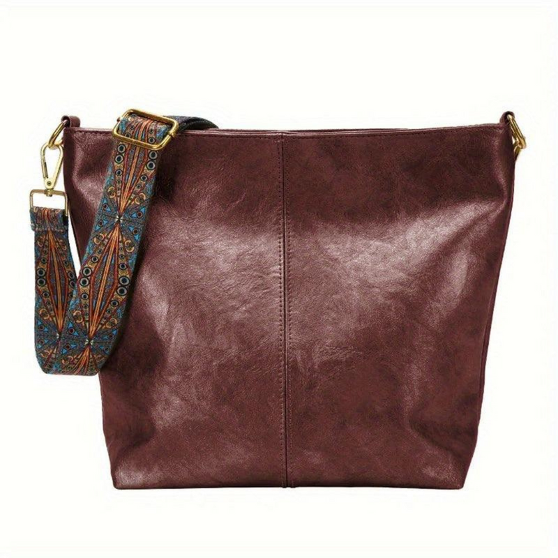 Laden Sie das Bild in Galerie -Viewer, Braune Ledertasche mit verziertem, abnehmbarem Schultergurt. Modische Damenhandtasche, ideal für Alltag und Büro. Hochwertiges Accessoire.
