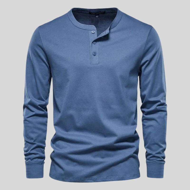 Laden Sie das Bild in Galerie -Viewer, Blaues Herren-Henley-Shirt mit langen Ärmeln und Knopfleiste, aus Baumwolle. Ideal für Freizeitmode und lässigen Stil.
