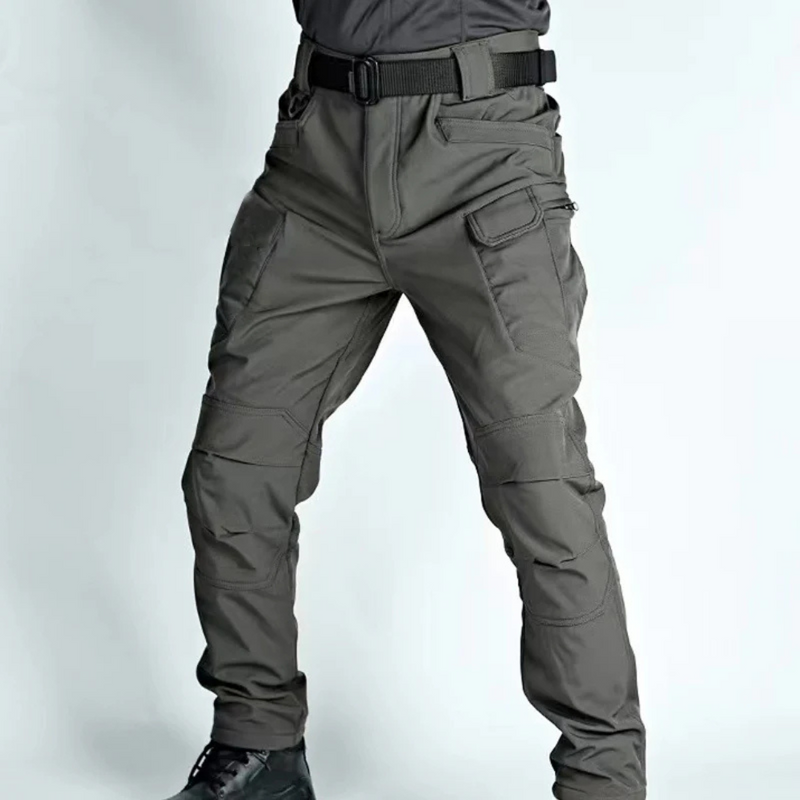 Laden Sie das Bild in Galerie -Viewer, Graue taktische Hose mit mehreren Taschen, robustem Stoff und Gürtel, ideal für Outdoor-Aktivitäten und Abenteuer. Hochwertige Funktionsbekleidung.
