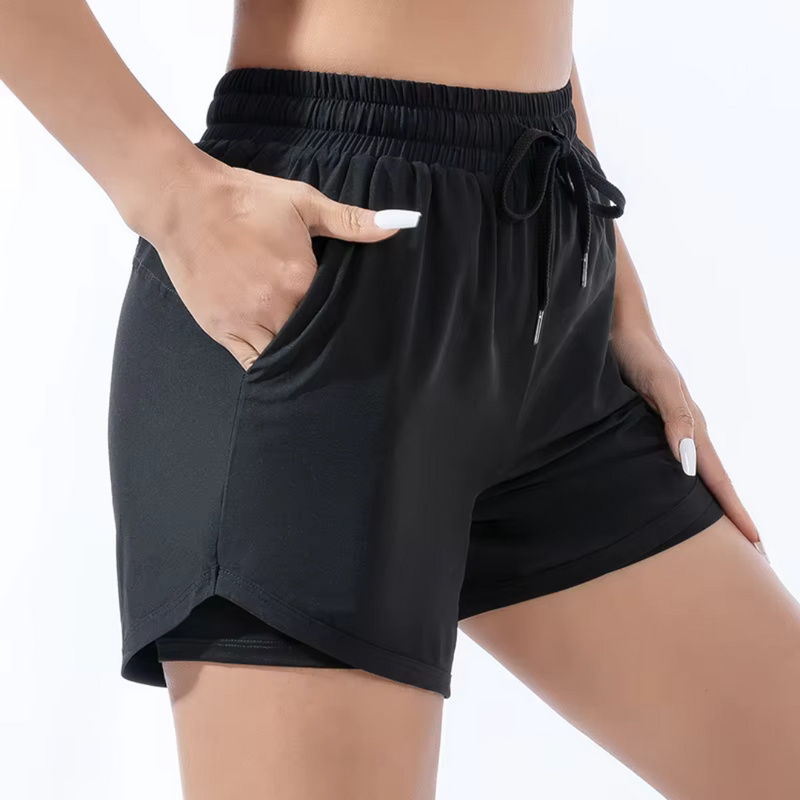 Laden Sie das Bild in Galerie -Viewer, Damen-Sportshorts in Schwarz, elastischer Bund, Kordelzug, seitliche Taschen, atmungsaktives Material, ideal für Fitness und Freizeit.
