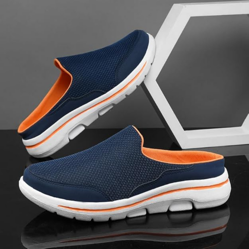 Laden Sie das Bild in Galerie -Viewer, Dunkelblaue Herren-Slipper mit weißer Sohle und orangefarbenem Innenfutter, stilvoll und bequem, ideal für Freizeit und Alltag.

