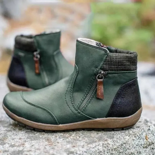 Grüne Damenstiefeletten mit Reißverschluss, rutschfeste Sohle und schwarzem Fersenbereich, ideal für Herbstmode und Outdoor-Aktivitäten.